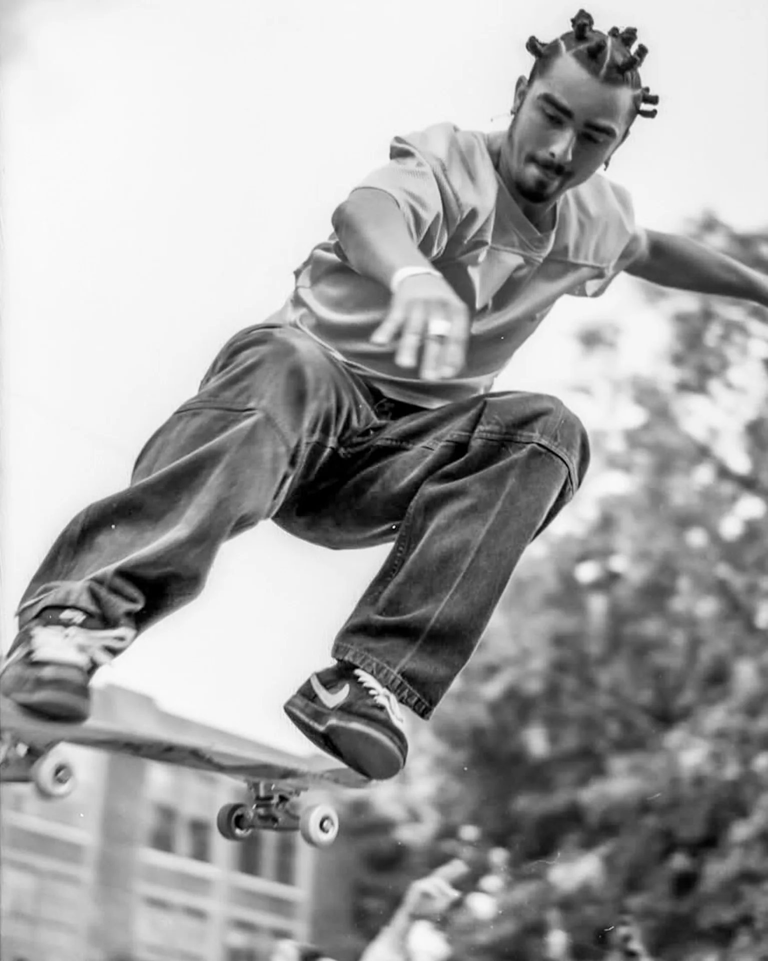 Skater captured airborne in a black-and-white editorial action frame