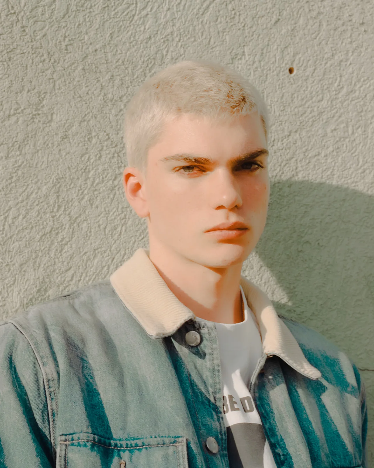 Editorial portrait with vintage mannequins, fashion-inspired creative photography