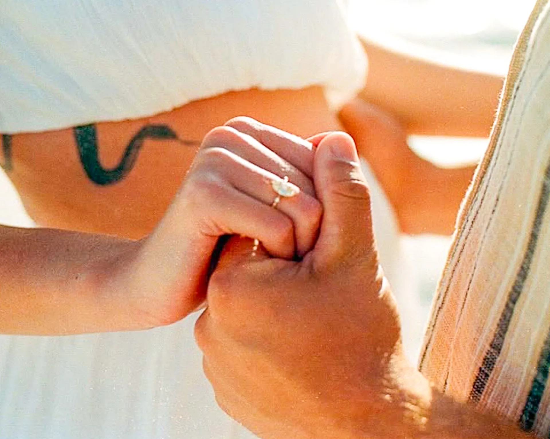 Engagement detail of hands and rings photographed with warm Portra color