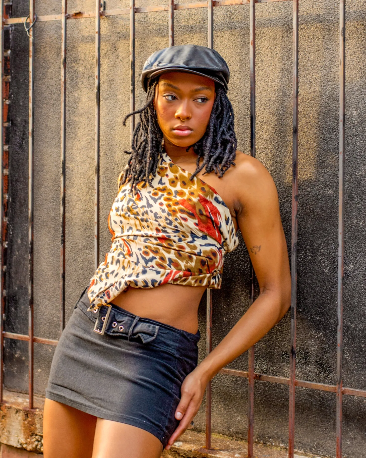 Digital editorial portrait with a leopard print cap and direct flash styling