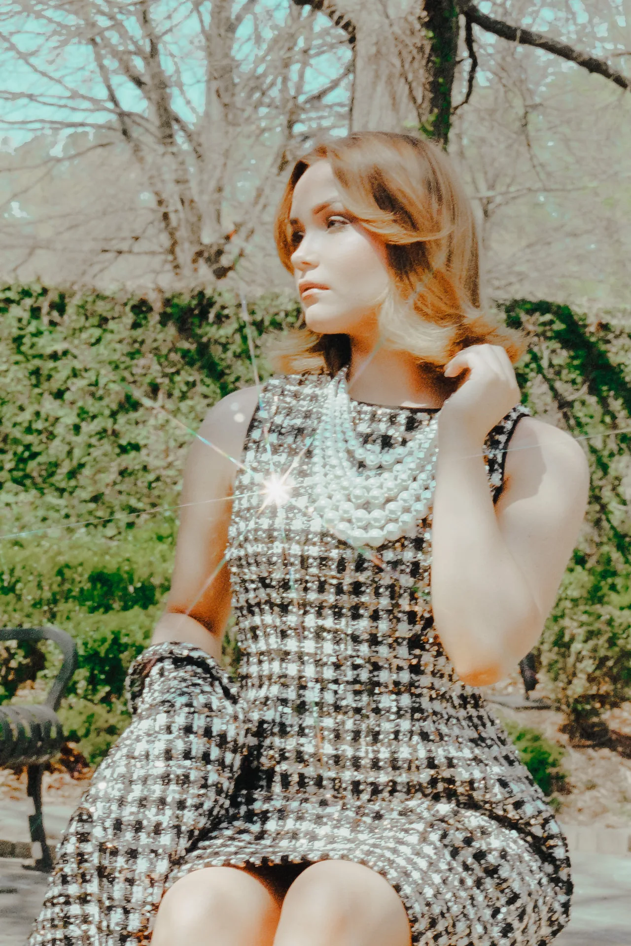 Editorial garden portrait with pearls and tweed styling on CineStill 400D film