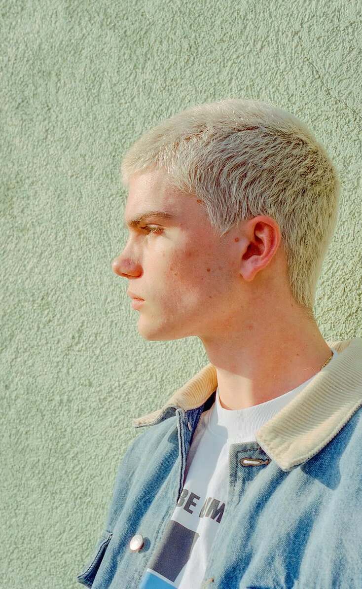Denim editorial portrait with crisp CineStill film color and direct styling
